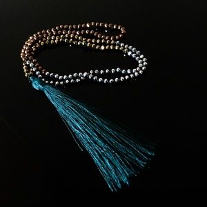 Silk tassel bead necklace teal color